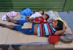 family-sleeping-on-street